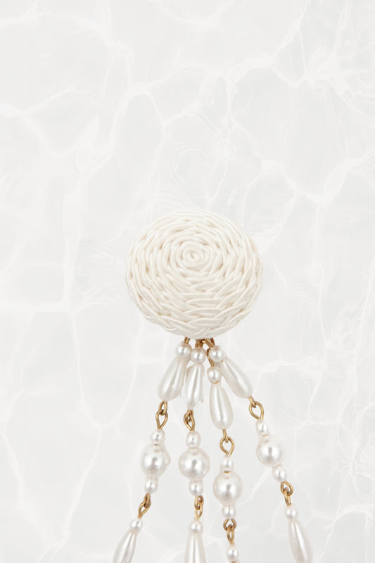 Vintage satin cord dome and faux pearl shoulder duster clip earrings, close-up detail on textured background — Disco Palma