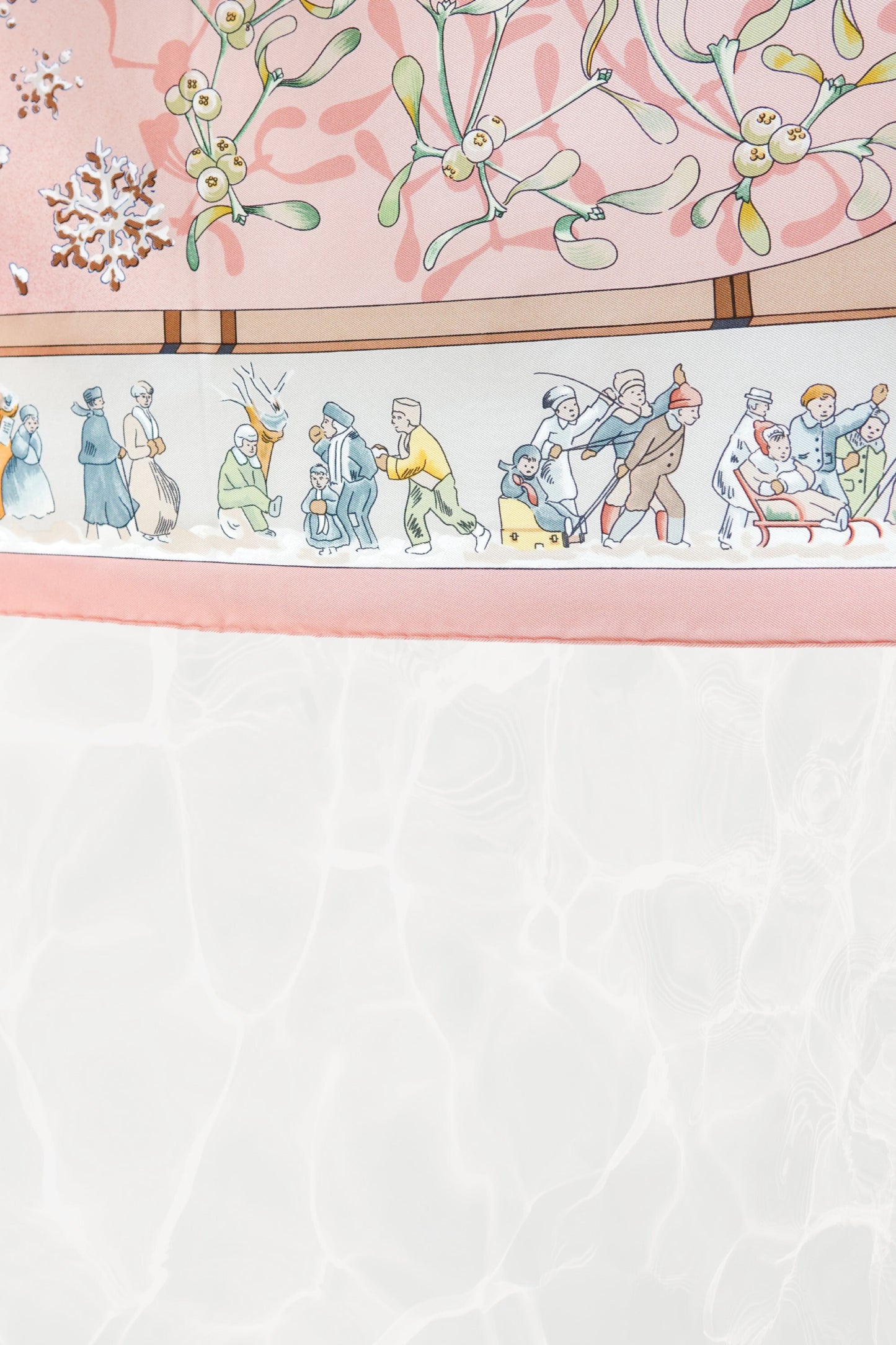 Hermès Neige d'Antan Carré 90 border detail: skiers, sledders, and winter figures in folk-art style on cream ground, pink silk twill