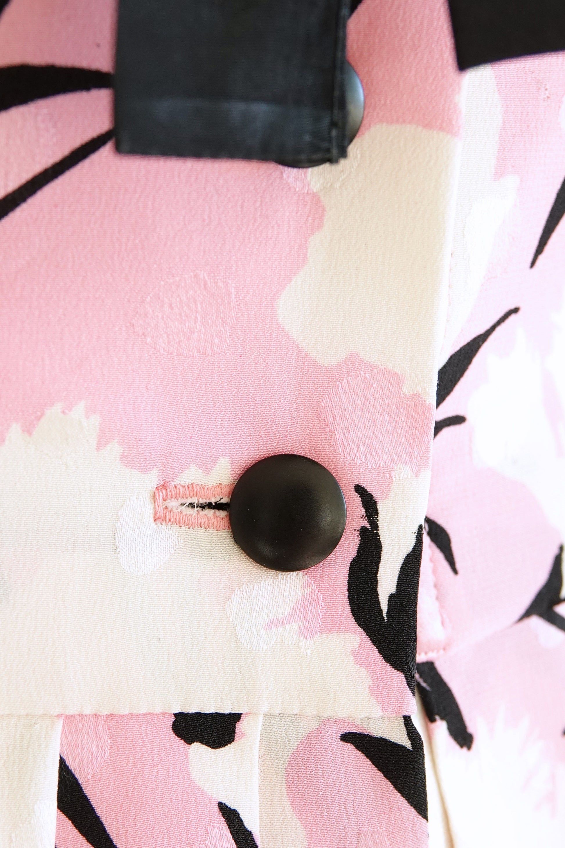 Black silk bow detail at center front bust — Disco Palma