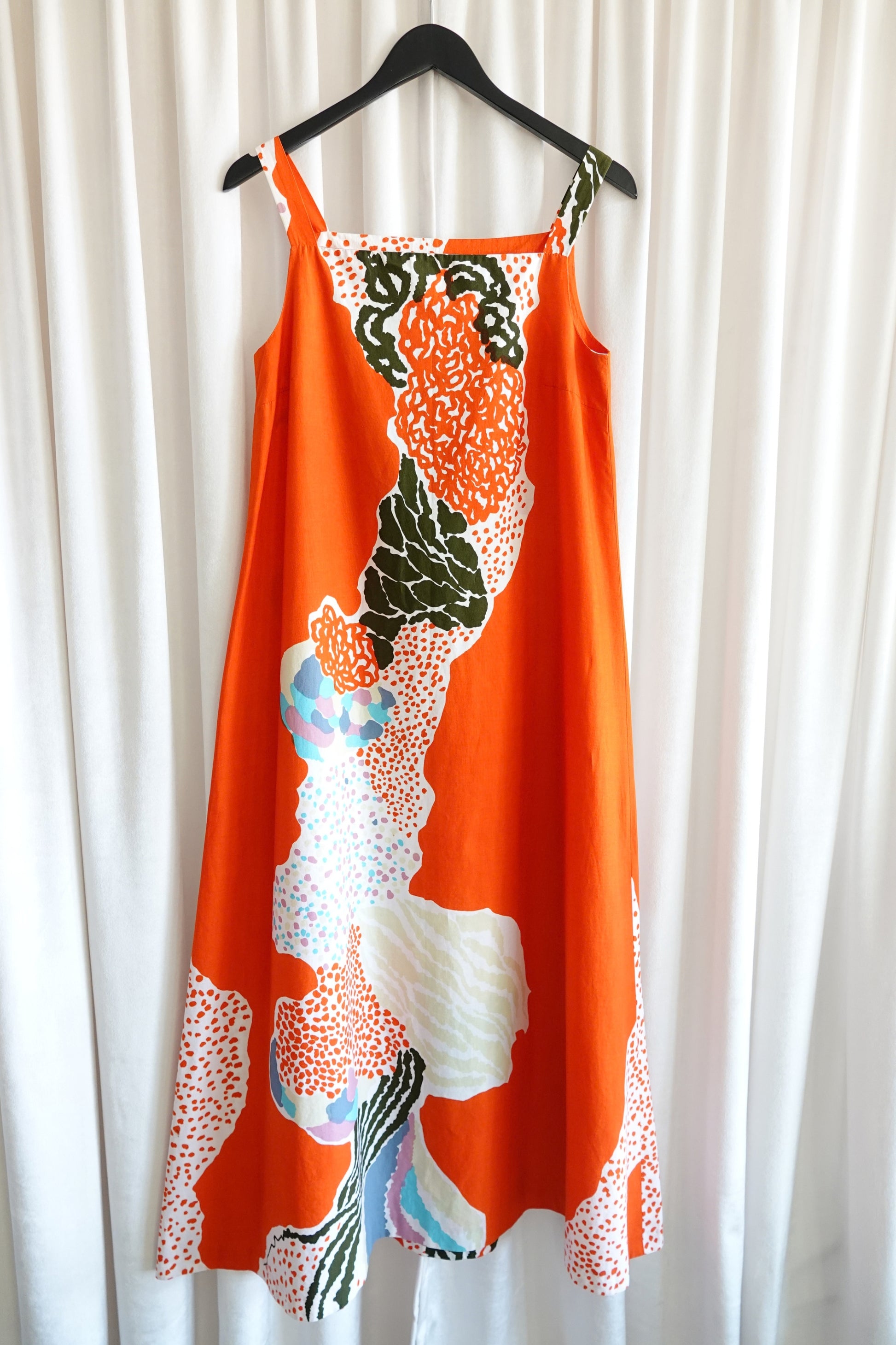 Marimekko 1978 orange abstract print maxi dress, full length on hanger — Disco Palma