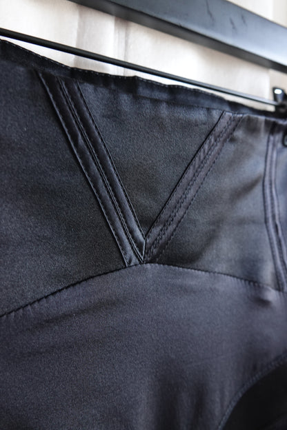 Tom Ford for Gucci FW03 black silk skirt back waistband detail: close-up of v-notch inverted point construction with topstitched panel seams, precision tailoring, Fall 2003