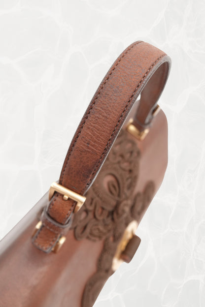 Interior view showing pristine amber leather lining of vintage Prada bag