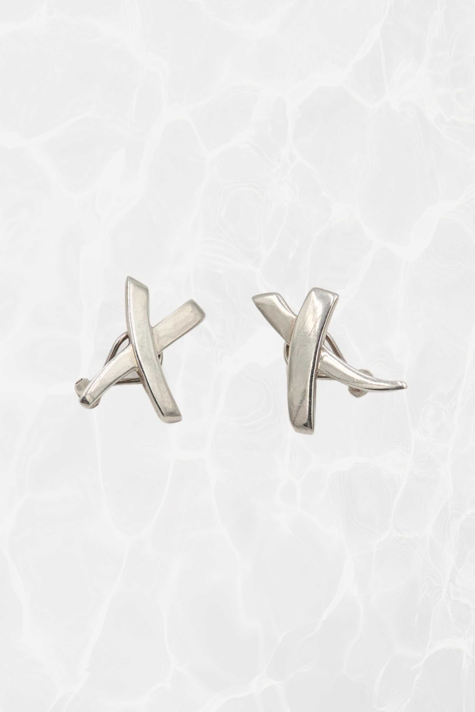 Vintage 1985 Paloma Picasso for Tiffany & Co. sterling silver Kiss X stud earrings: front view showing both earrings with iconic X and kiss motif design