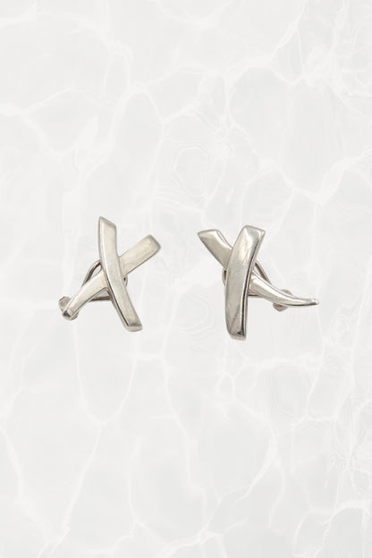 Vintage 1985 Paloma Picasso for Tiffany & Co. sterling silver Kiss X stud earrings: front view showing both earrings with iconic X and kiss motif design