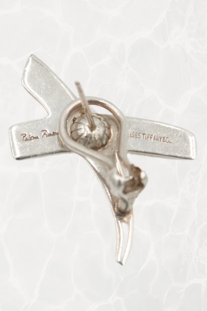 Vintage 1985 Paloma Picasso for Tiffany & Co. sterling silver Kiss X earrings: close-up detail of single earring showing the sculptural X form and polished silver finish