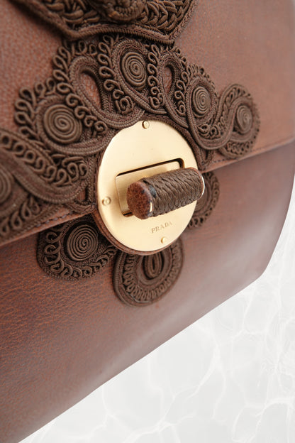 Bottom view of vintage Prada Antic Passamane brown goat leather bag