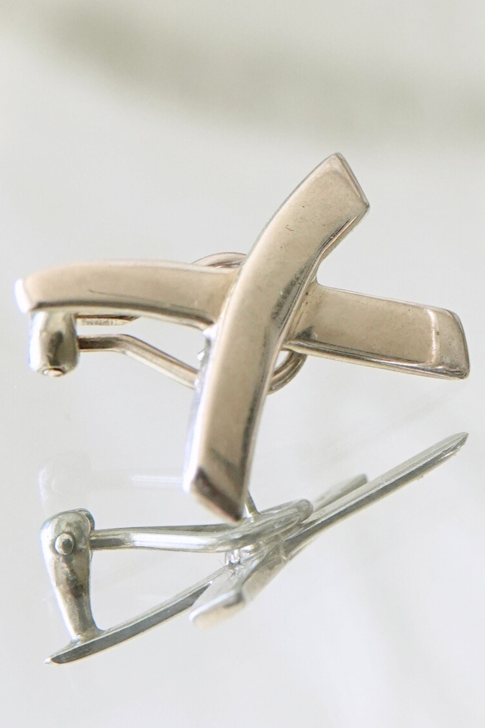 Vintage 1985 Paloma Picasso for Tiffany & Co. sterling silver Kiss X earrings: reverse side view showing post and butterfly backs with Tiffany hallmark stamping