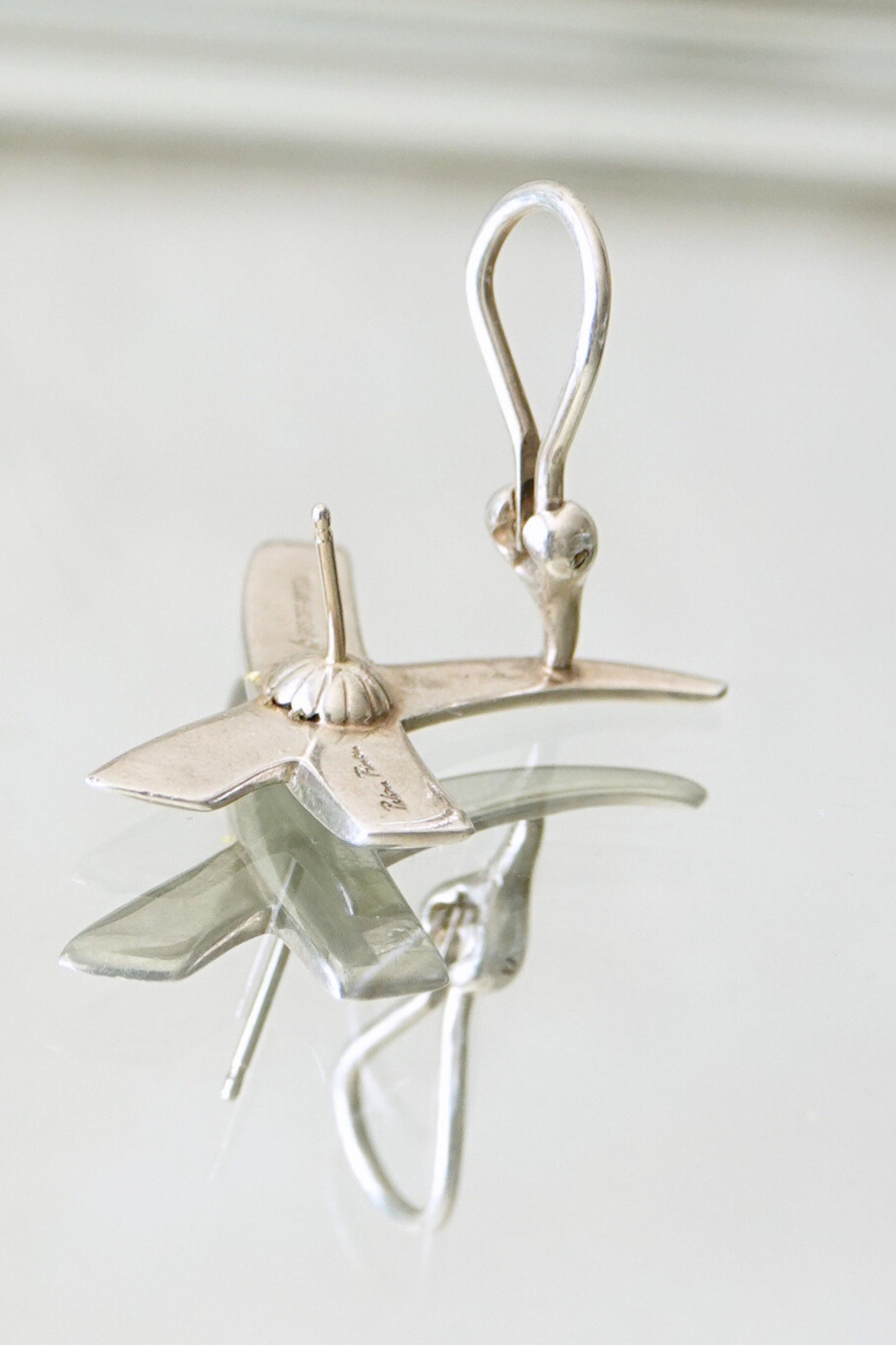 Vintage 1985 Paloma Picasso for Tiffany & Co. sterling silver Kiss X earrings: side profile view of both earrings showing the three-dimensional sculptural form of the X design