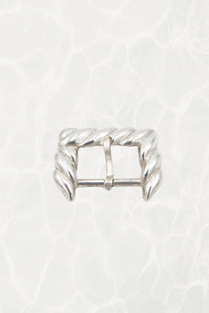 Vintage 1988 Tiffany & Co. sterling silver belt buckle: full front view showing the sculptural rope motif design and overall rectangular buckle form