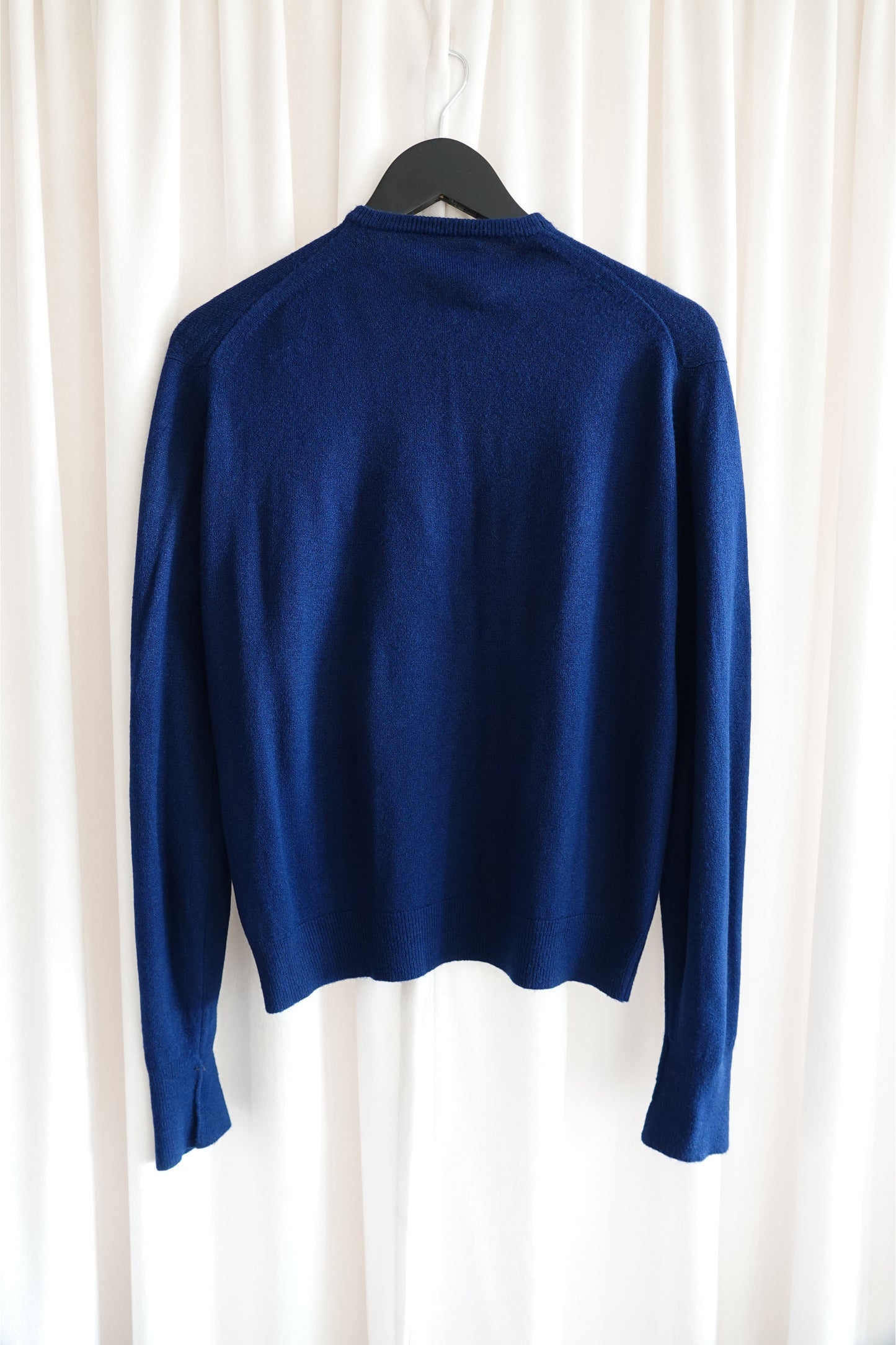 Schiaparelli vintage navy cardigan, back view on hanger — Disco Palma