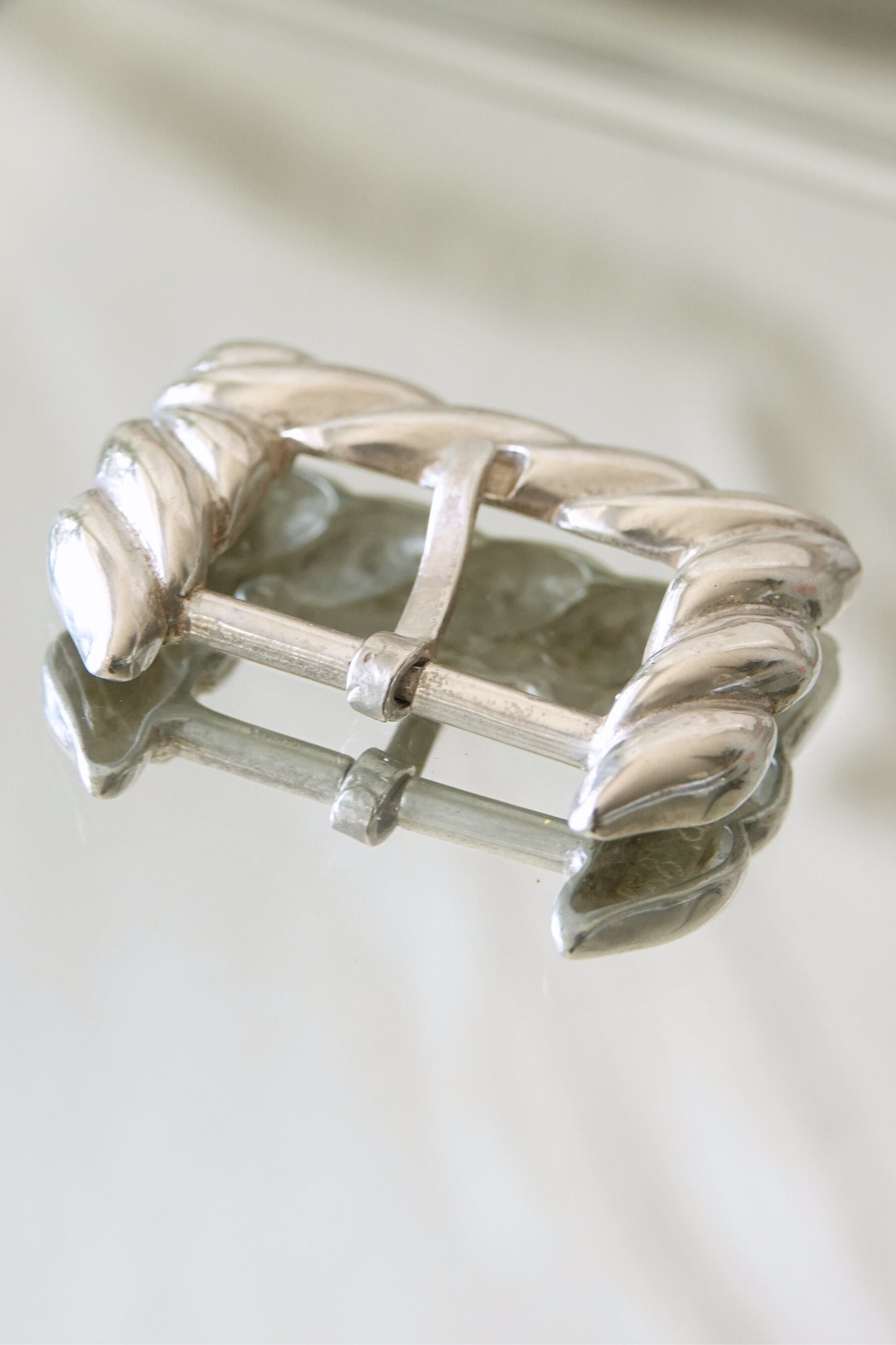 Vintage 1988 Tiffany & Co. sterling silver belt buckle: side profile view showing the buckle depth and the raised rope border construction