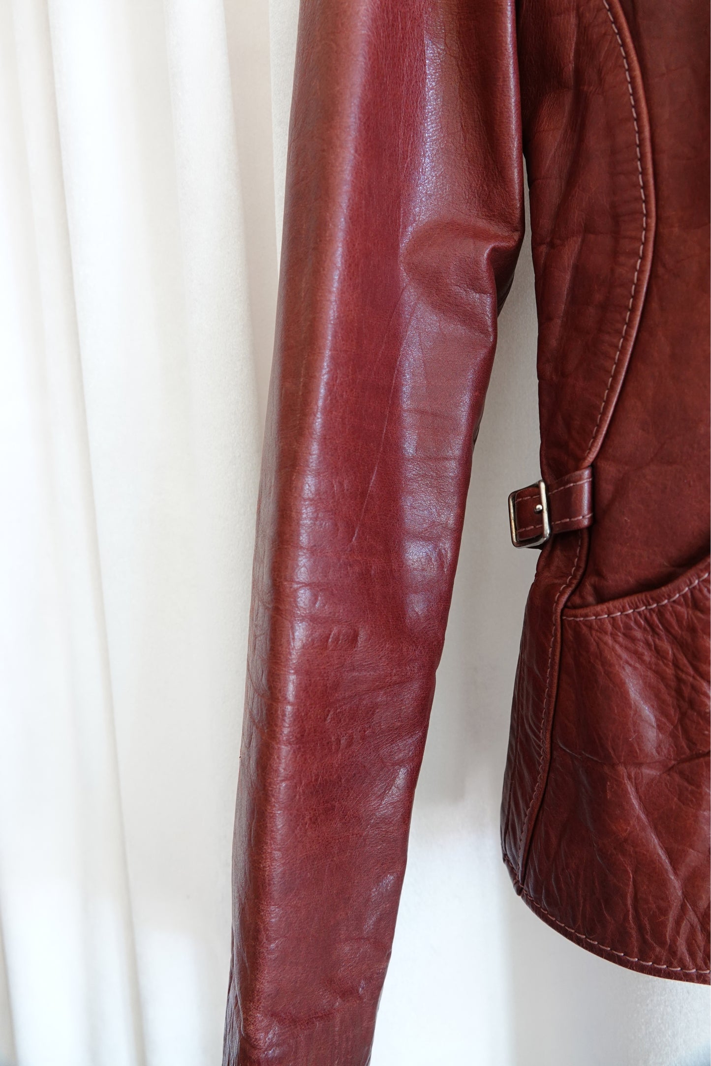 East West Musical Instruments 1970s burgundy leather jacket, condition detail — Disco Palma