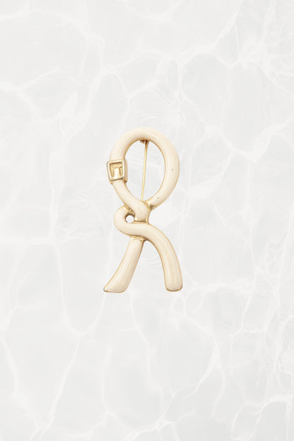 1980's Cream & Gold Enamel Ribbon “R” Logo Brooch
