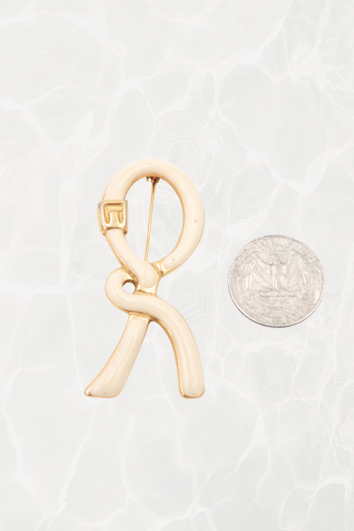 1980's Cream & Gold Enamel Ribbon “R” Logo Brooch