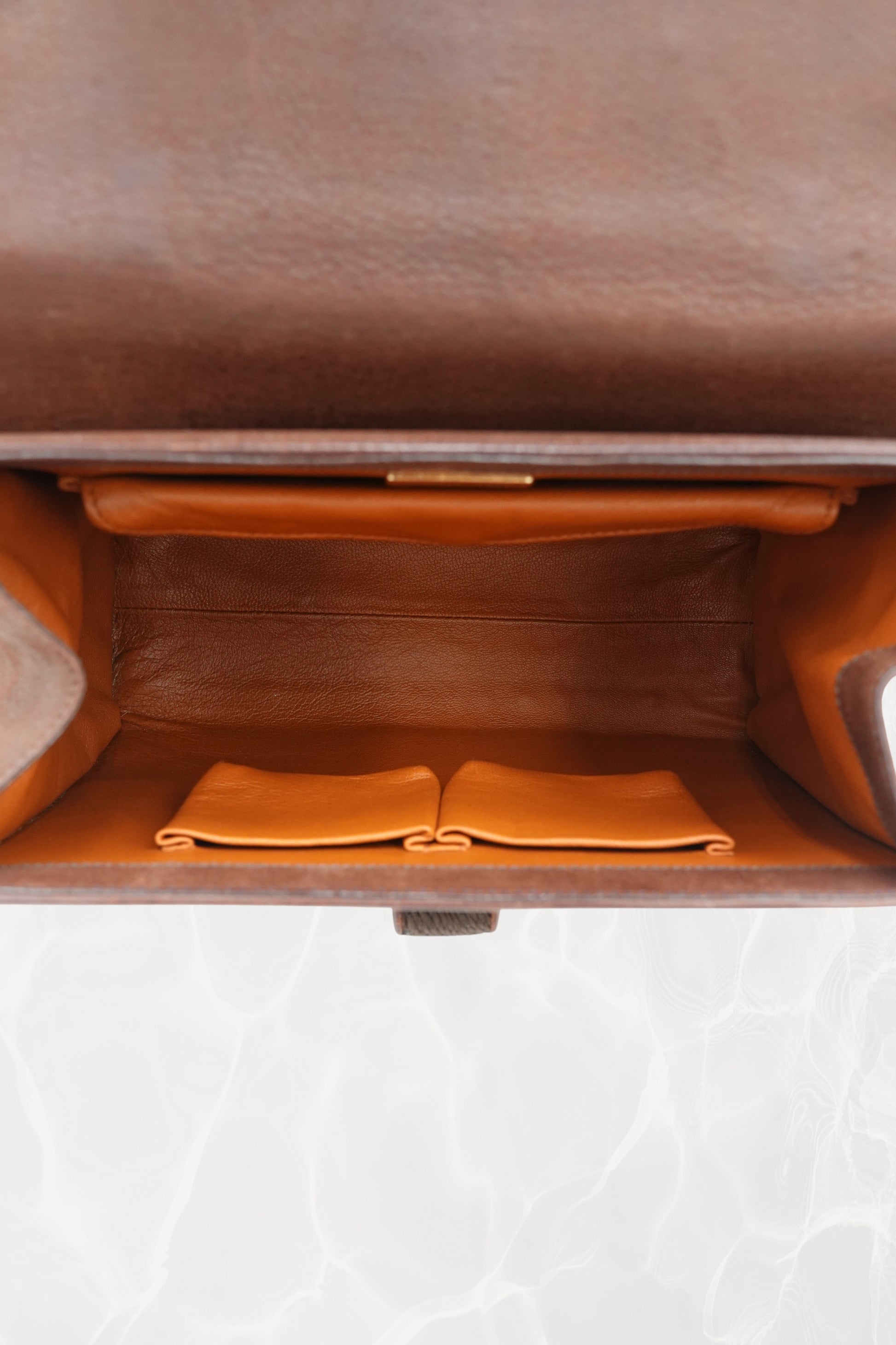 Natural patina detail on vintage 1990s Prada Antic Passamane goat leather bag