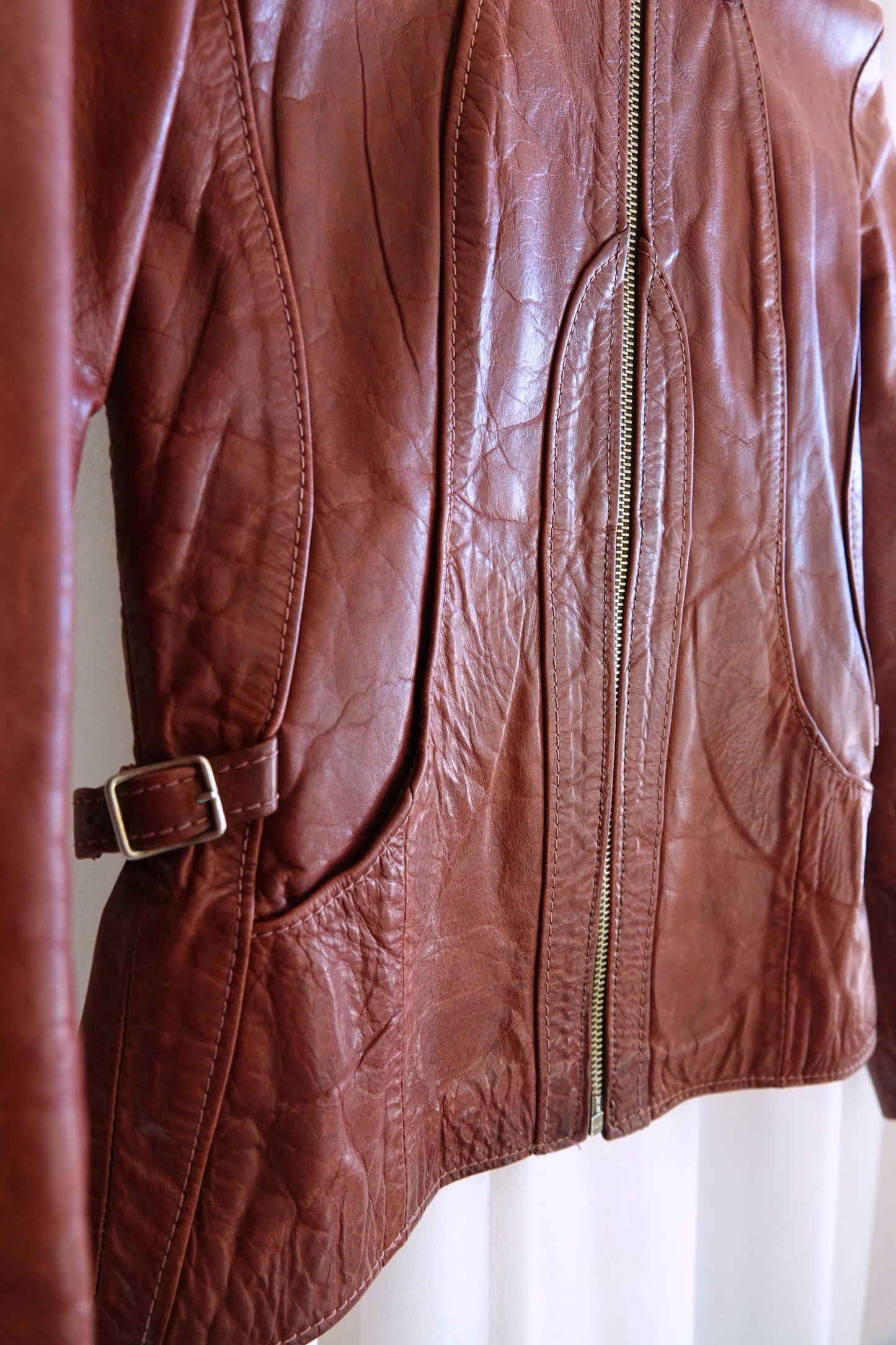 East West Musical Instruments 1970s burgundy leather jacket, condition close-up — Disco Palma
