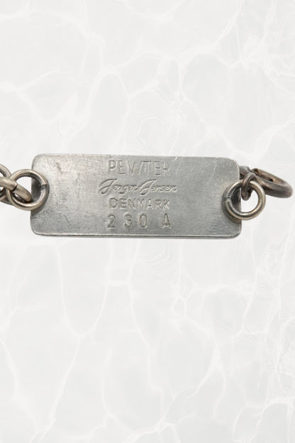 Jørgen Jensen pewter bracelet — reverse view showing stamped tag: PEWTER / Jørgen Jensen / DENMARK / 230 A