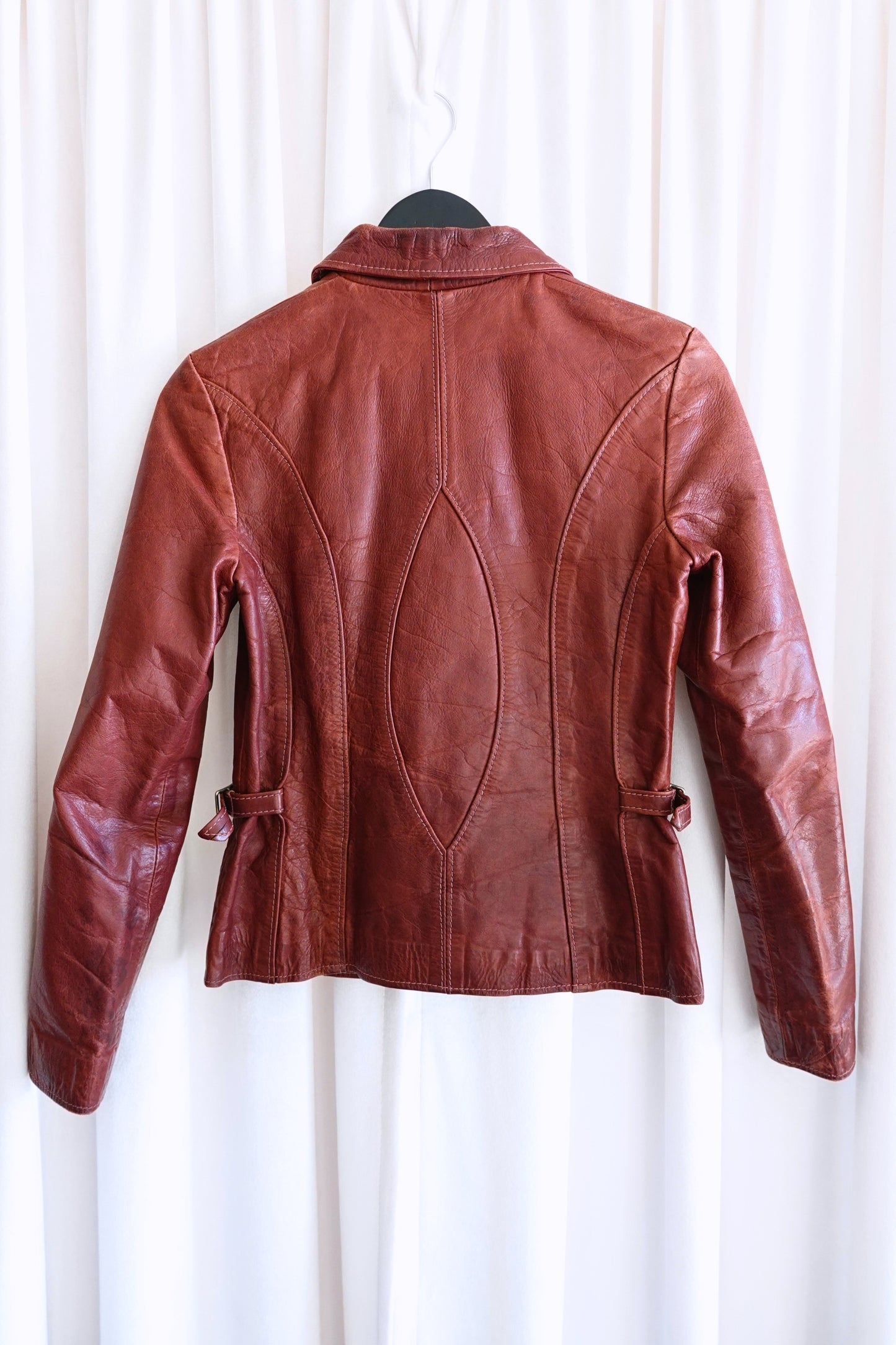 East West Musical Instruments 1970s burgundy leather jacket, side wear detail — Disco Palma