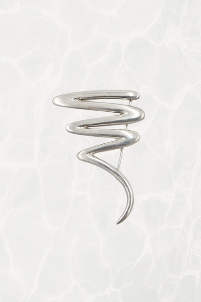 Vintage Paloma Picasso sterling silver Scribble brooch: front view showing the full abstract expressionist swirl design against neutral background