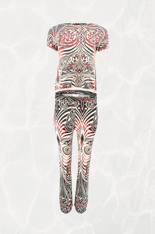 Jean Paul Gaultier JPG Jeans SS96 Cyberbaba 2-piece set flat-lay: short-sleeve crop top and pull-on pants in black, white and red tribal tattoo print jersey