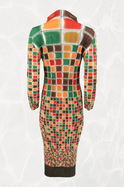 Pleats Please Issey Miyake SS94 sculptural mosaic print midi dress back view: full-length rear view showing multicolor grid print in red, orange, green, and brown on pleated fabric, long sleeves, Spring/Summer 1994