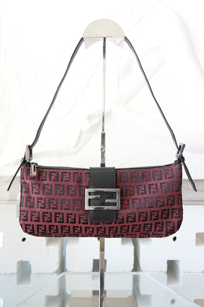 Fendi Zucchino FF monogram baguette, front view on display stand — Disco Palma
