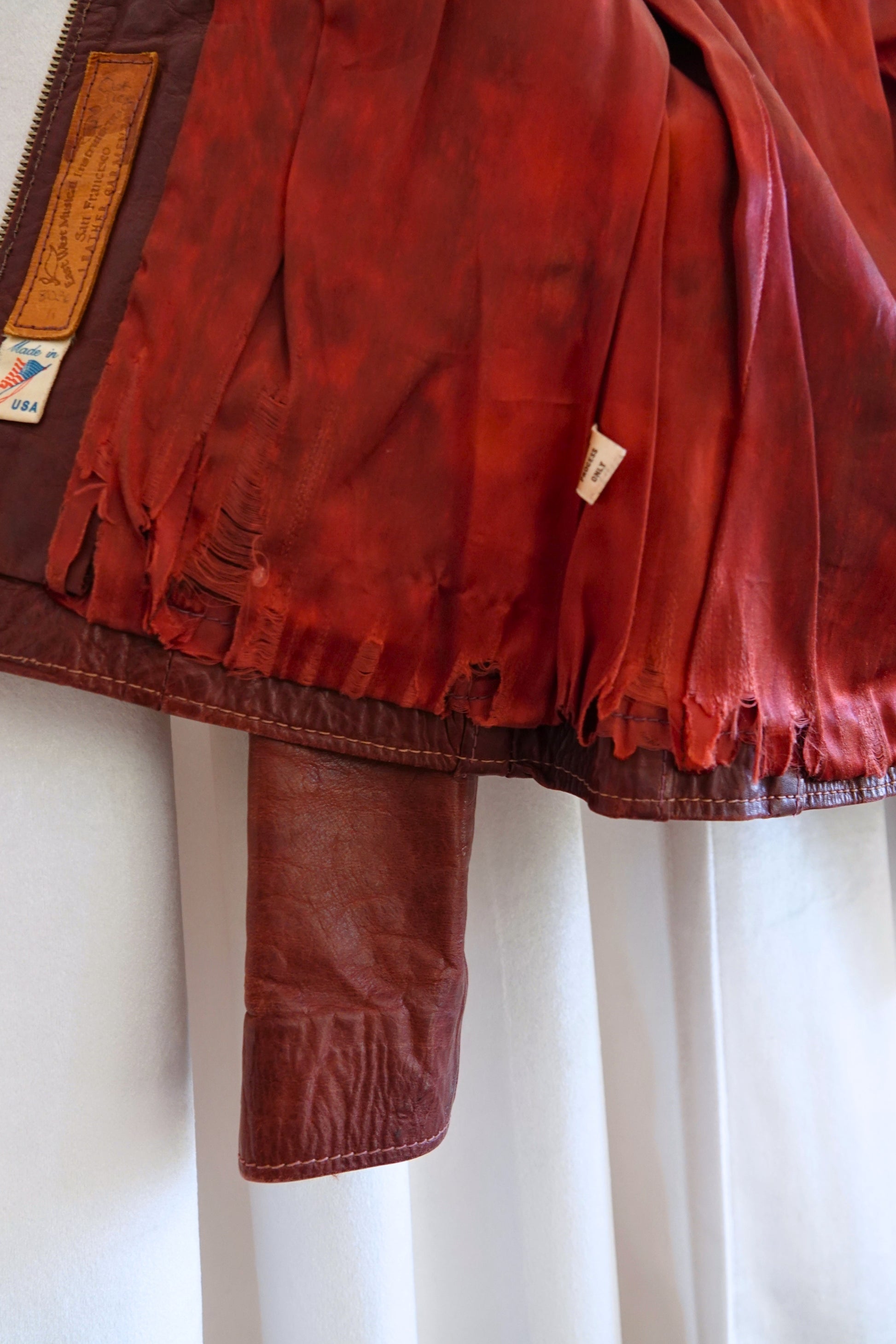 East West Musical Instruments 1970s burgundy leather jacket, condition reference — Disco Palma