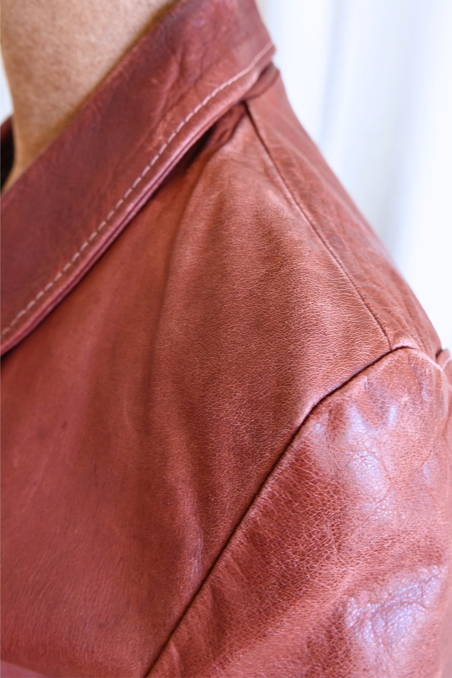 East West Musical Instruments 1970s burgundy leather jacket, label detail — Disco Palma