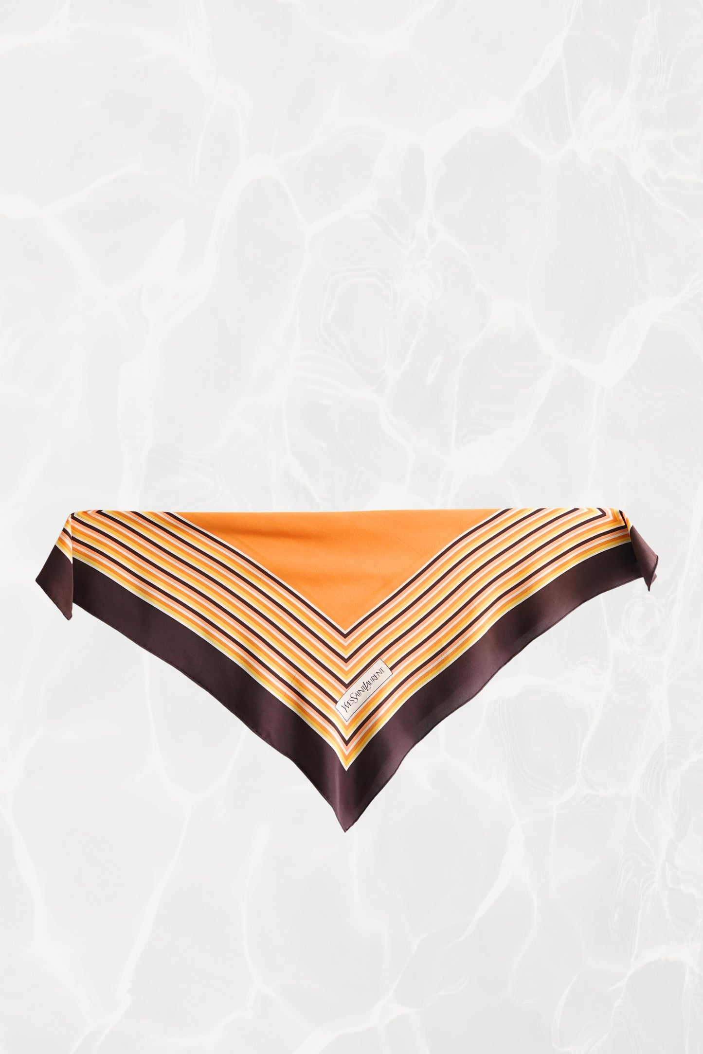 1970s YSL Yves Saint Laurent silk scarf: corner detail showing the geometric square border print in brown and orange with hand-rolled hem edge