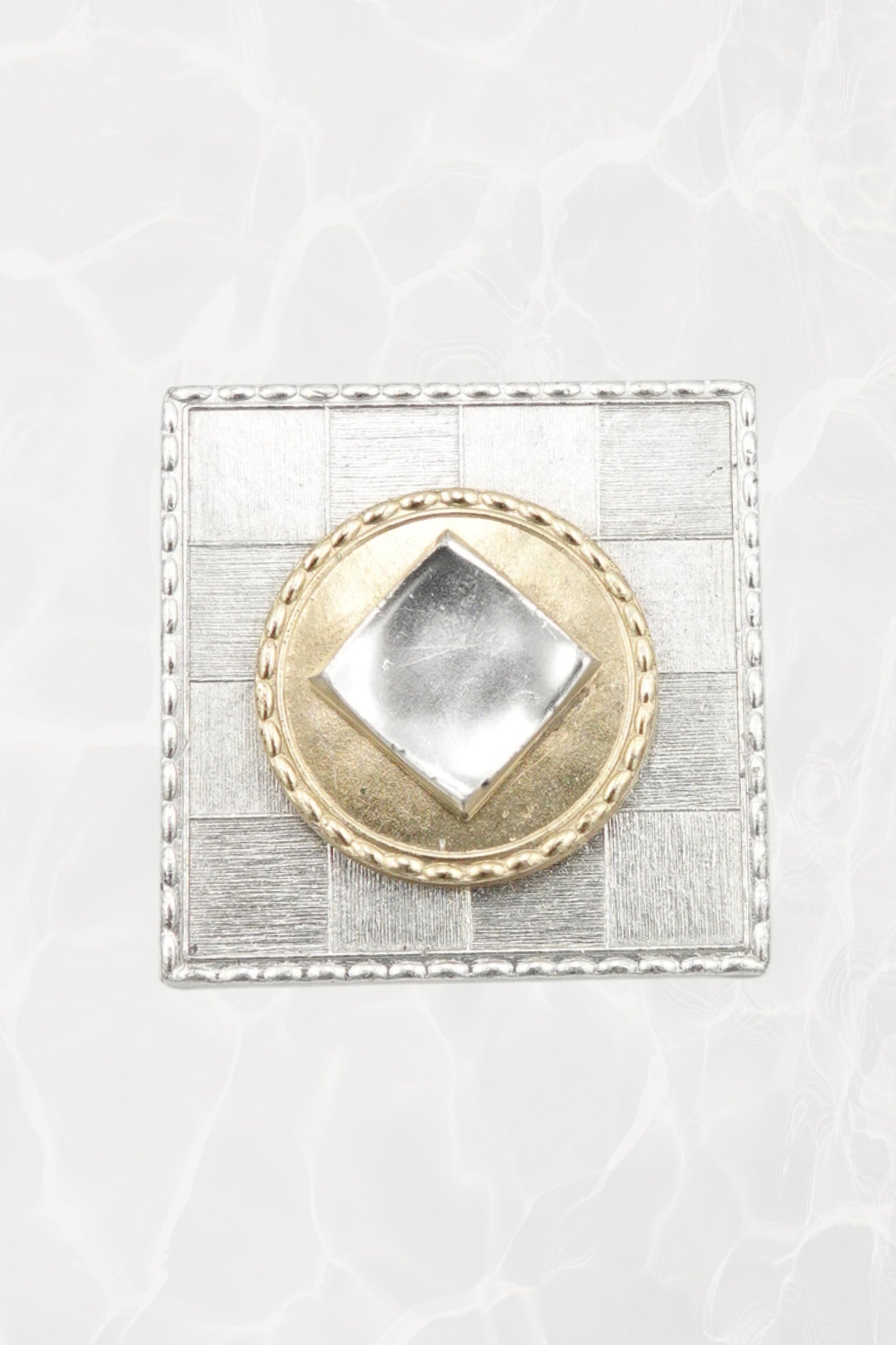 Vintage French square brooch — hero front view on pool background