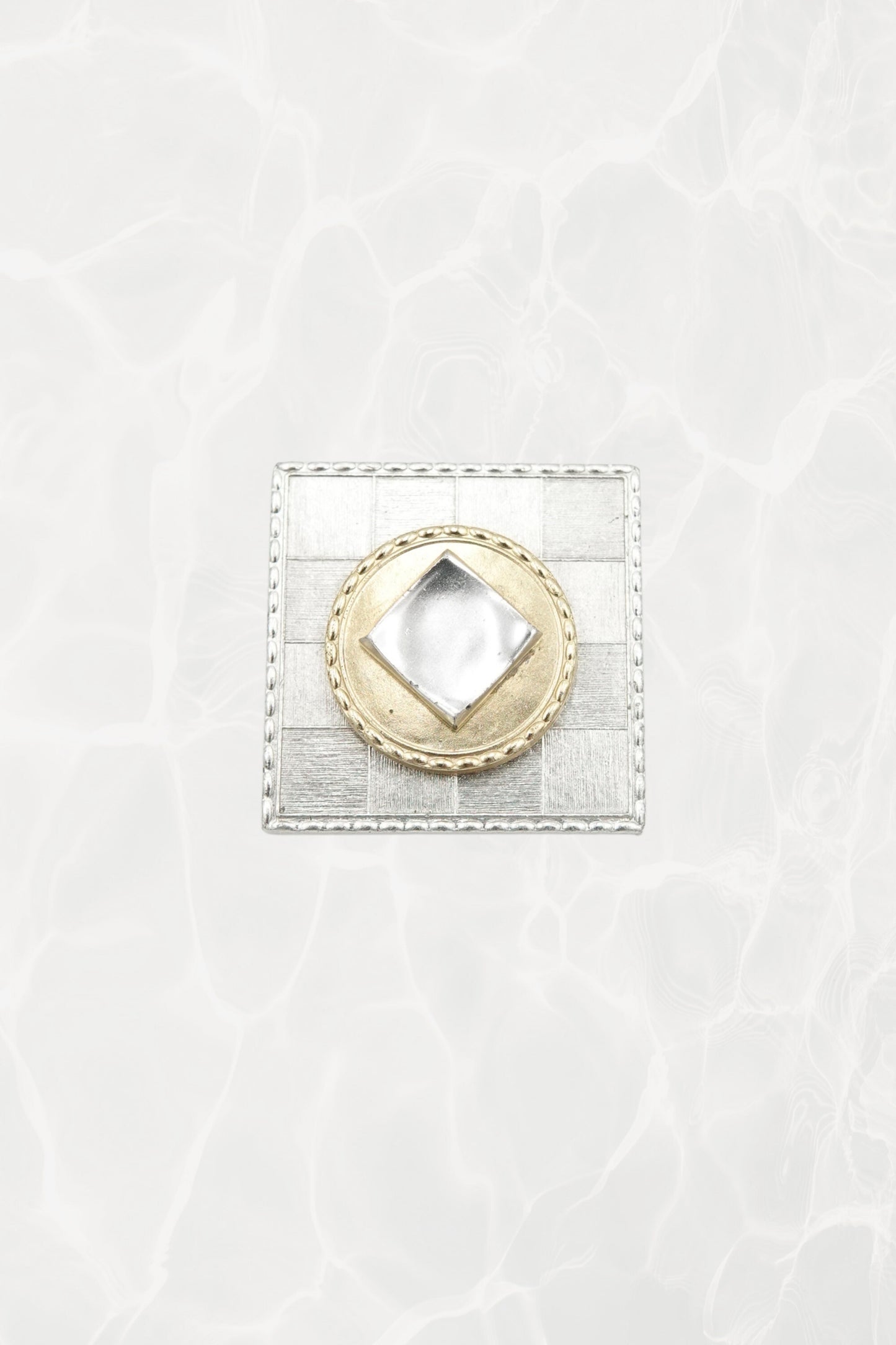 Made in France mixed metal brooch — angled front view