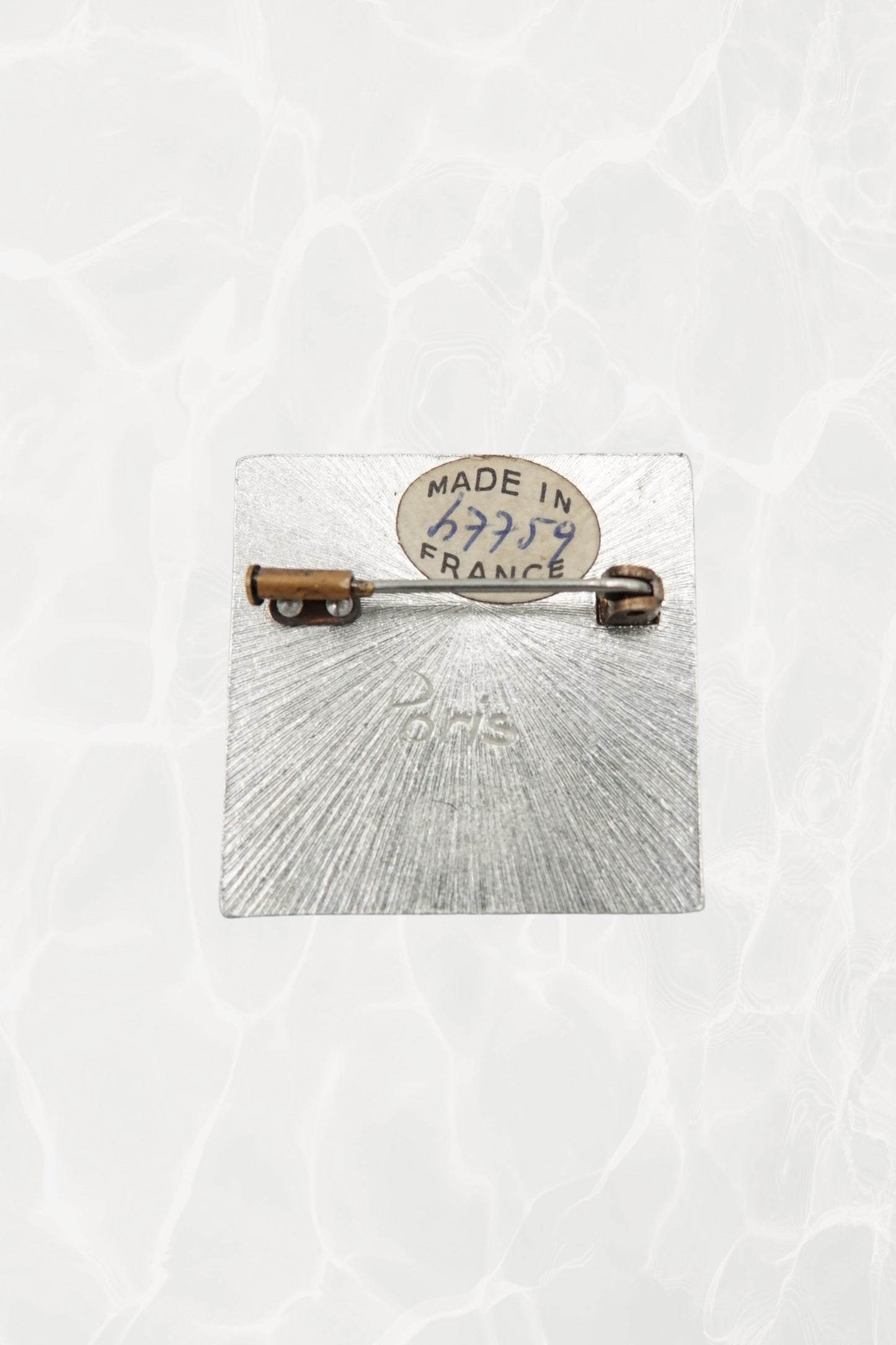 Vintage Paris brooch — back view showing Made in France label and Paris engraving