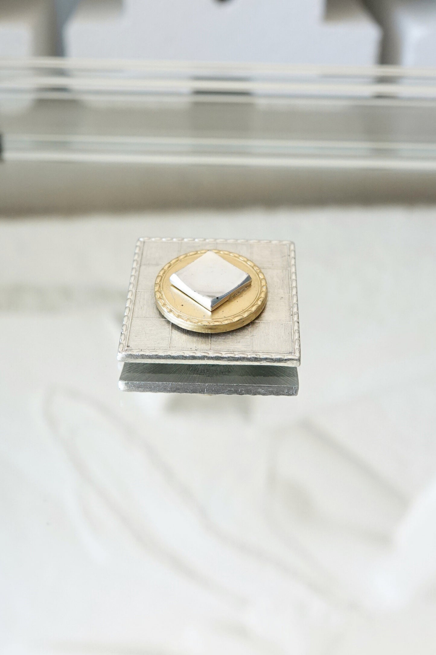 Vintage mixed metal square brooch, layered construction — styled top-down on stone prop — Disco Palma