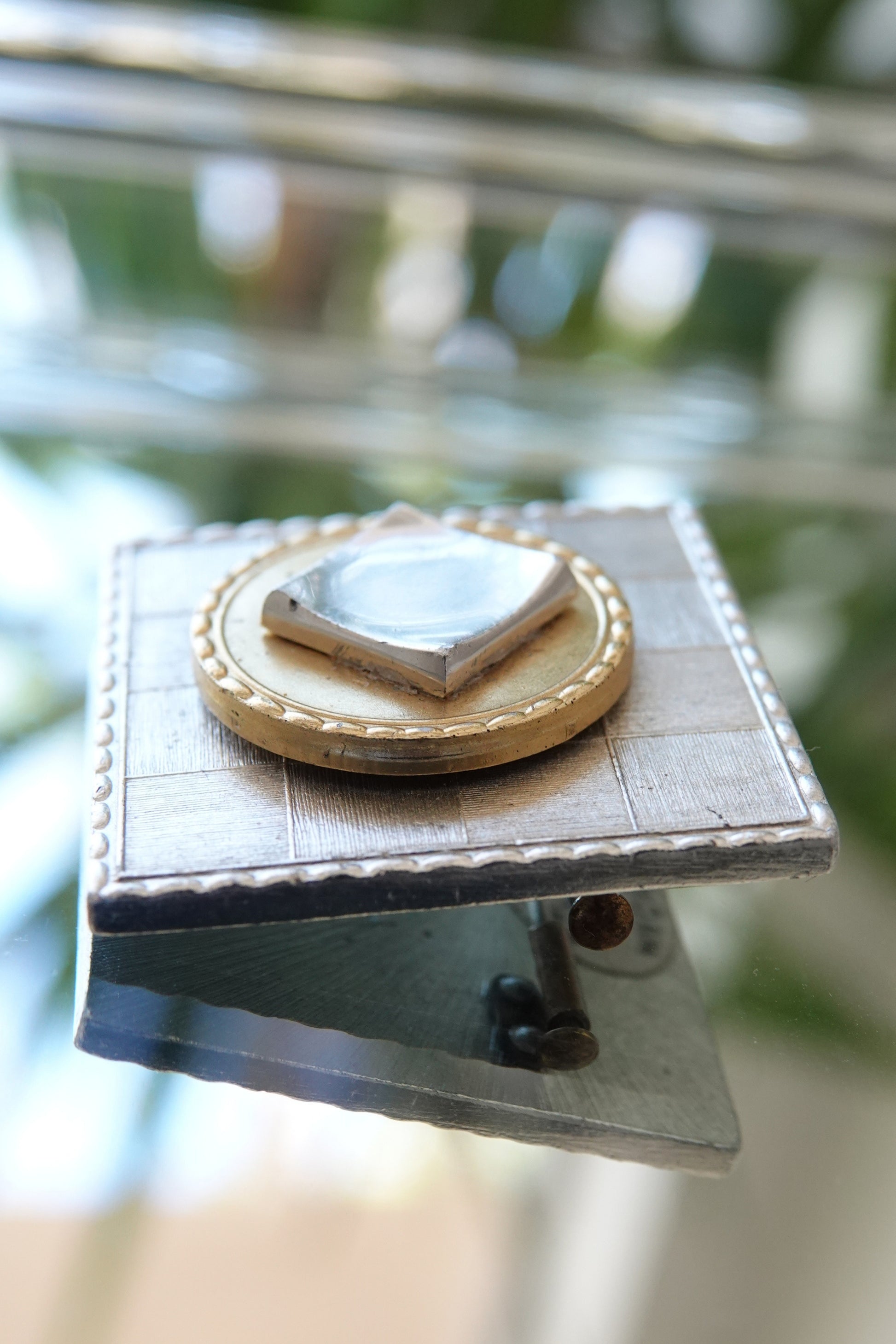 Made in France brooch — three-quarter view on glass