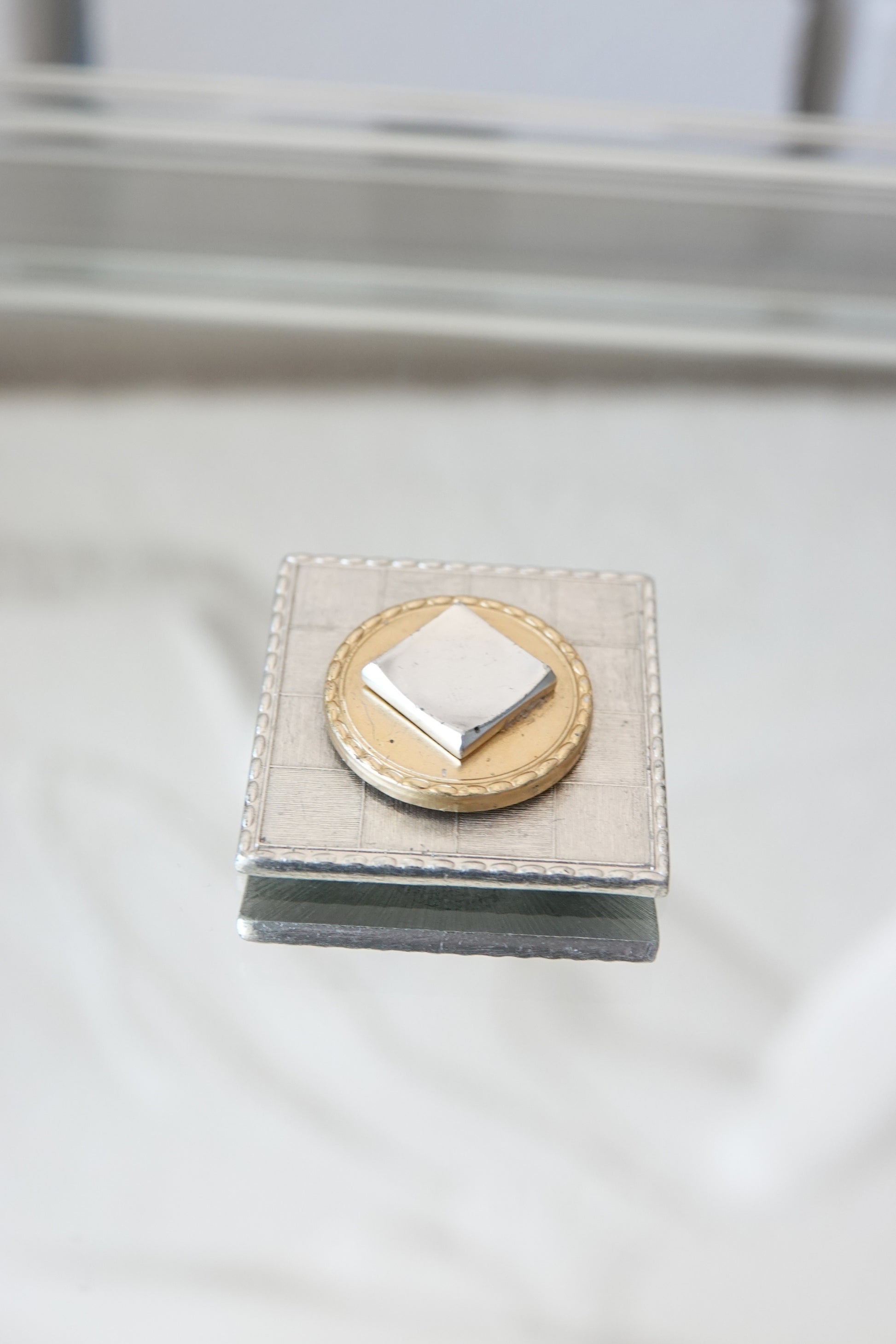 Mixed metal MOP brooch — close-up of gold medallion and pearl center