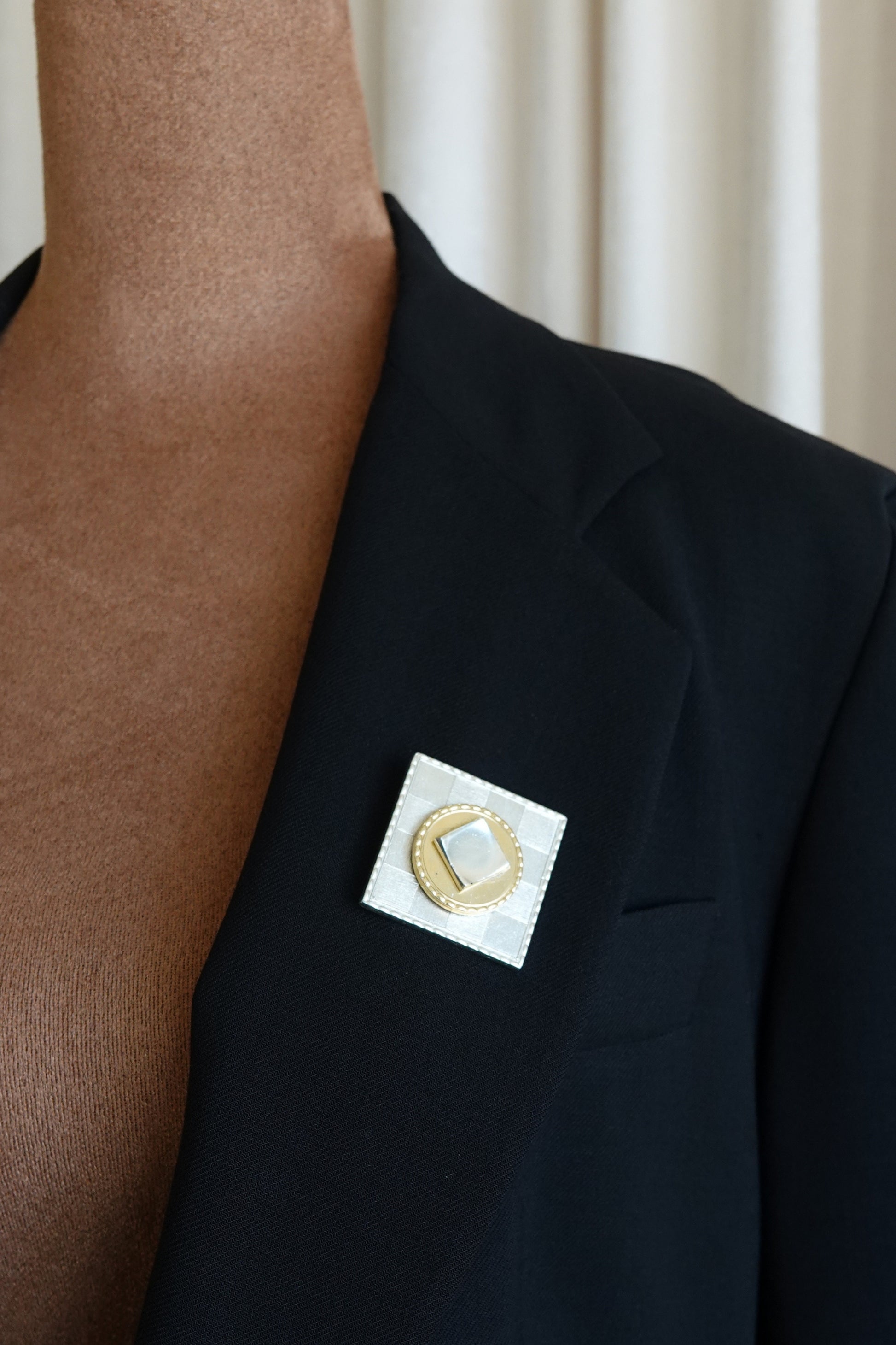 Vintage French brooch — styled on black blazer lapel