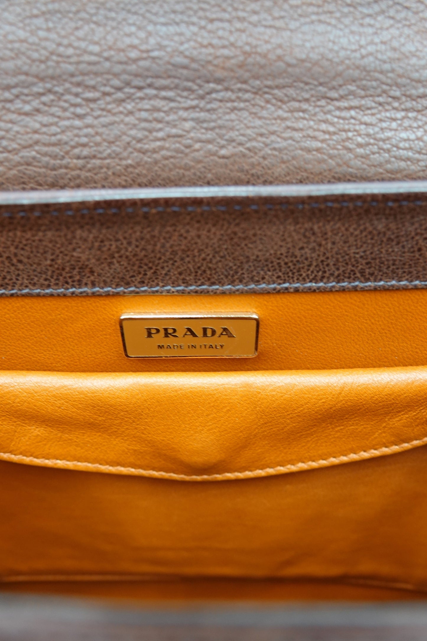 Vintage Prada Antic Passamane brown goat leather top handle bag, front showroom view — Disco Palma