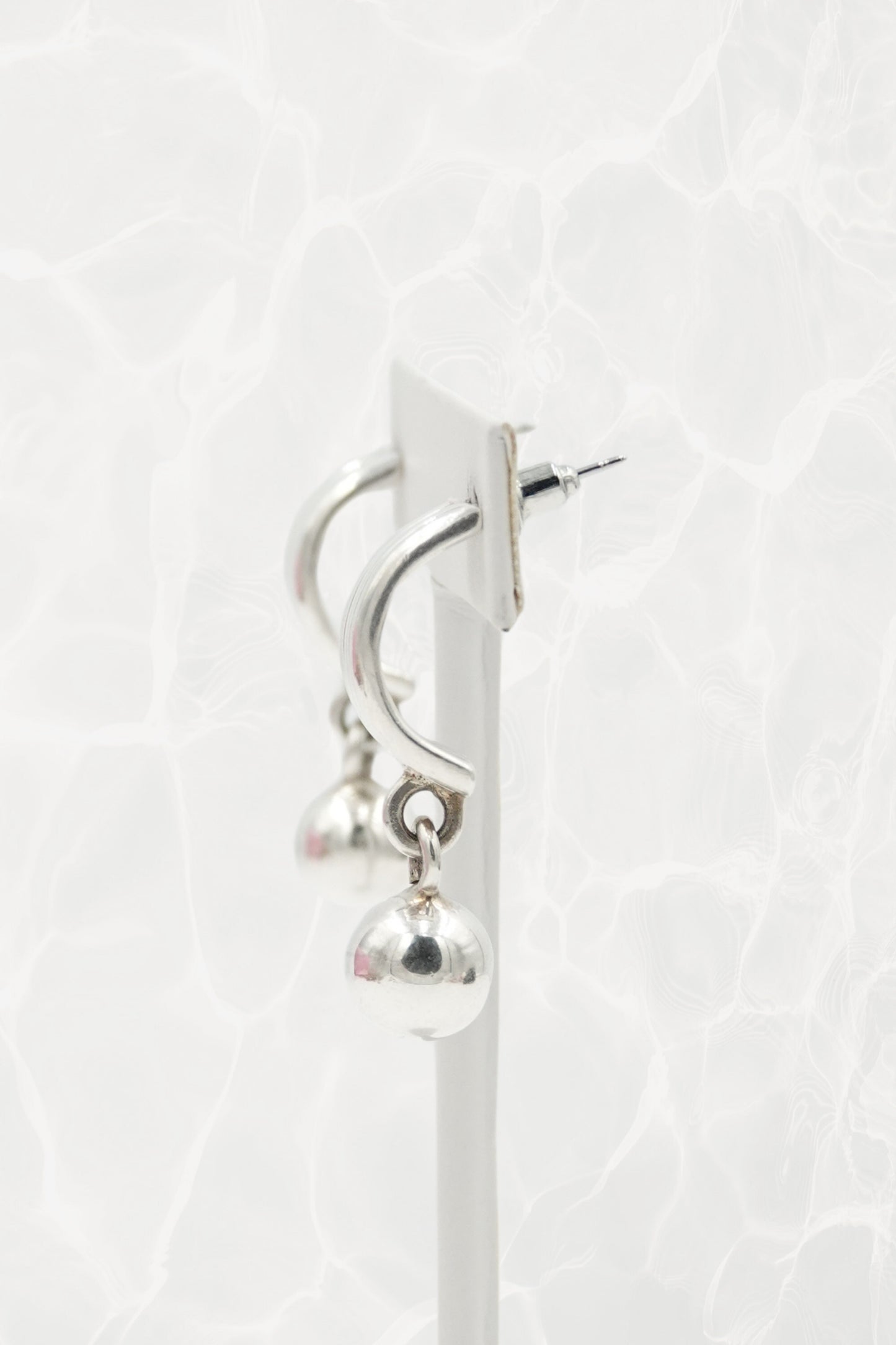 Mexican 925 silver ball dangle earrings — side angle on stand
