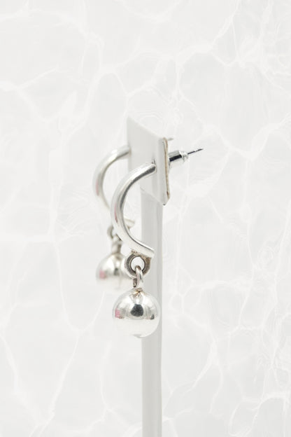 Mexican 925 silver ball dangle earrings — side angle on stand