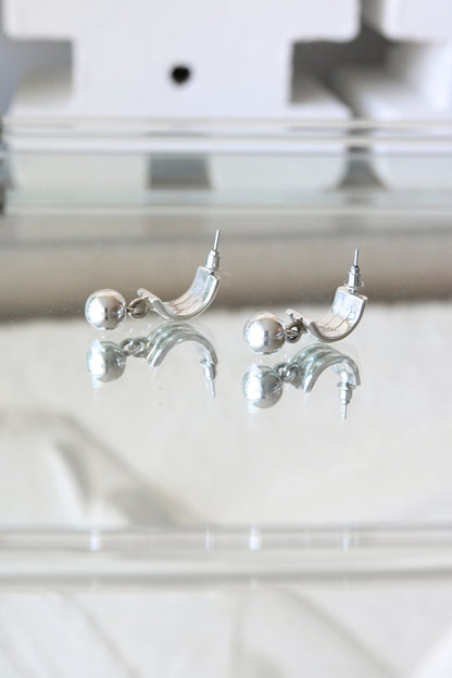 Sterling silver ball dangle earrings — close-up detail on glass