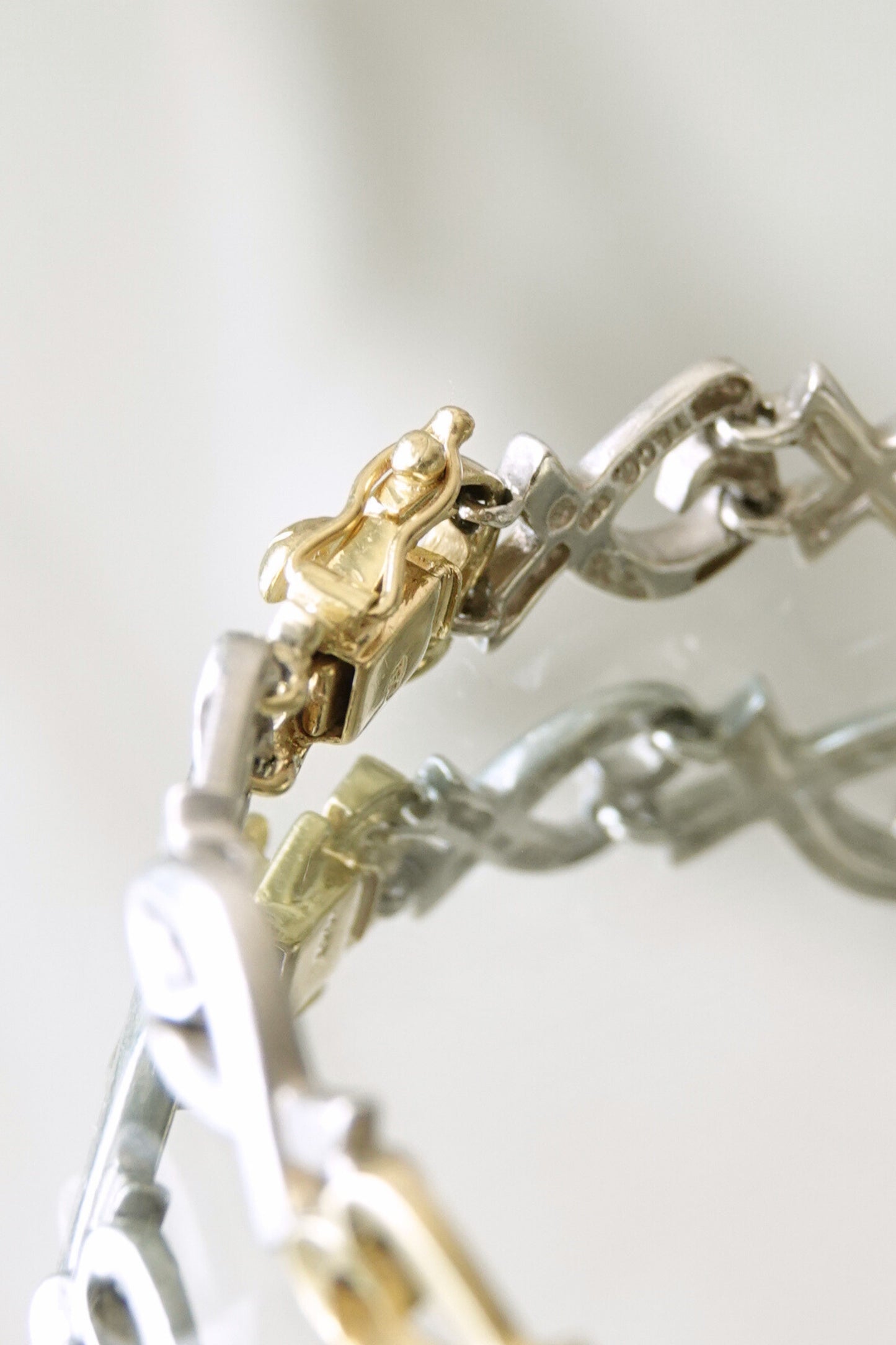 Paloma Picasso for Tiffany & Co. Loving Heart link bracelet: reverse side view showing smooth back of links and hallmark engravings on sterling silver and 18k gold
