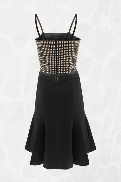 Loewe by Narciso Rodriguez AW01 studded leather dress side view: profile of fitted metal-studded leather corset bodice with elastic shoulder strap and paneled black silk flare skirt, AW2001