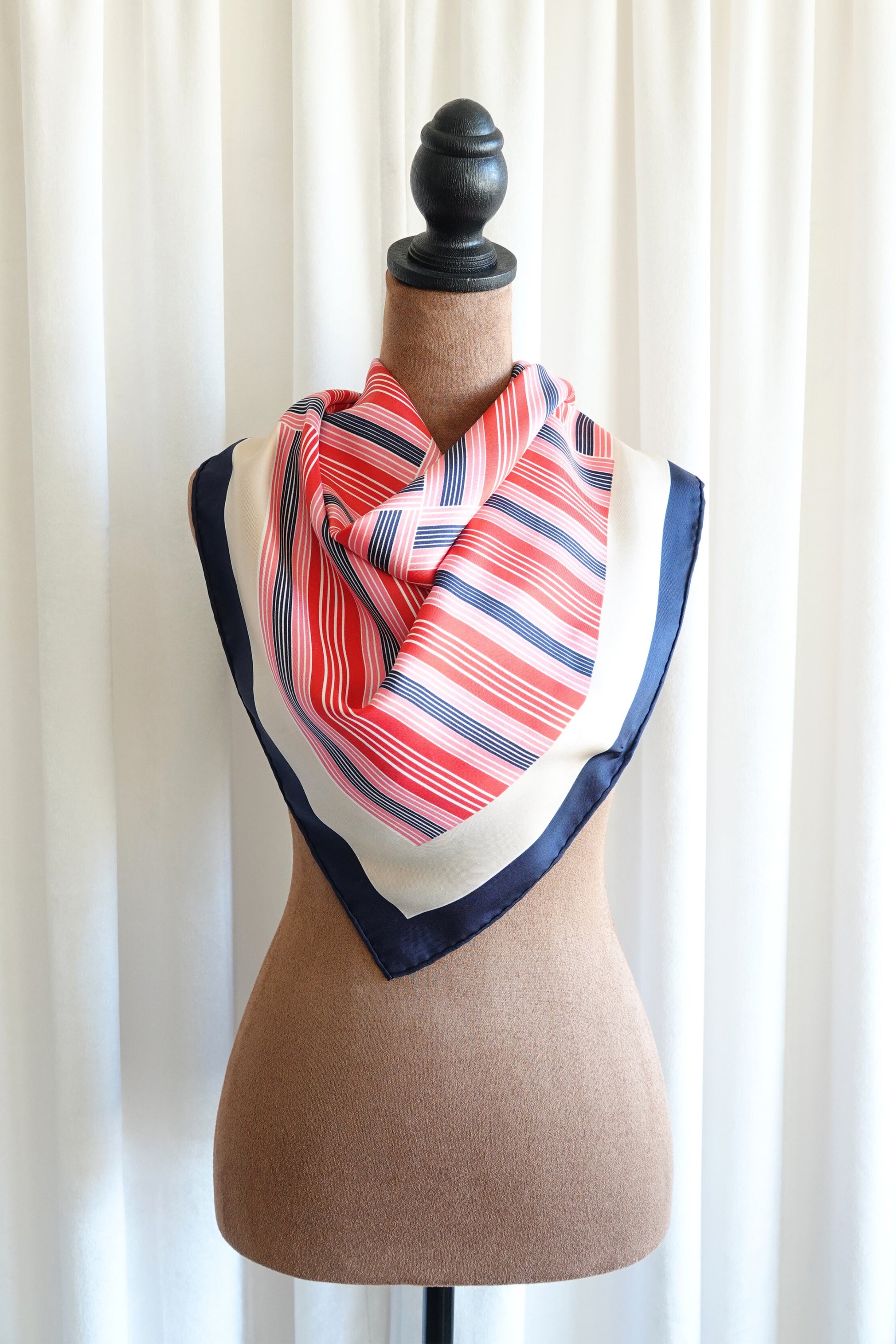 Late 1970s early 1980s YSL Yves Saint Laurent silk scarf: corner detail showing the hand-rolled hem and geometric stripe border meeting at scarf edge