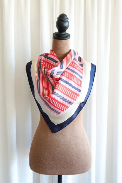 Late 1970s early 1980s YSL Yves Saint Laurent silk scarf: corner detail showing the hand-rolled hem and geometric stripe border meeting at scarf edge
