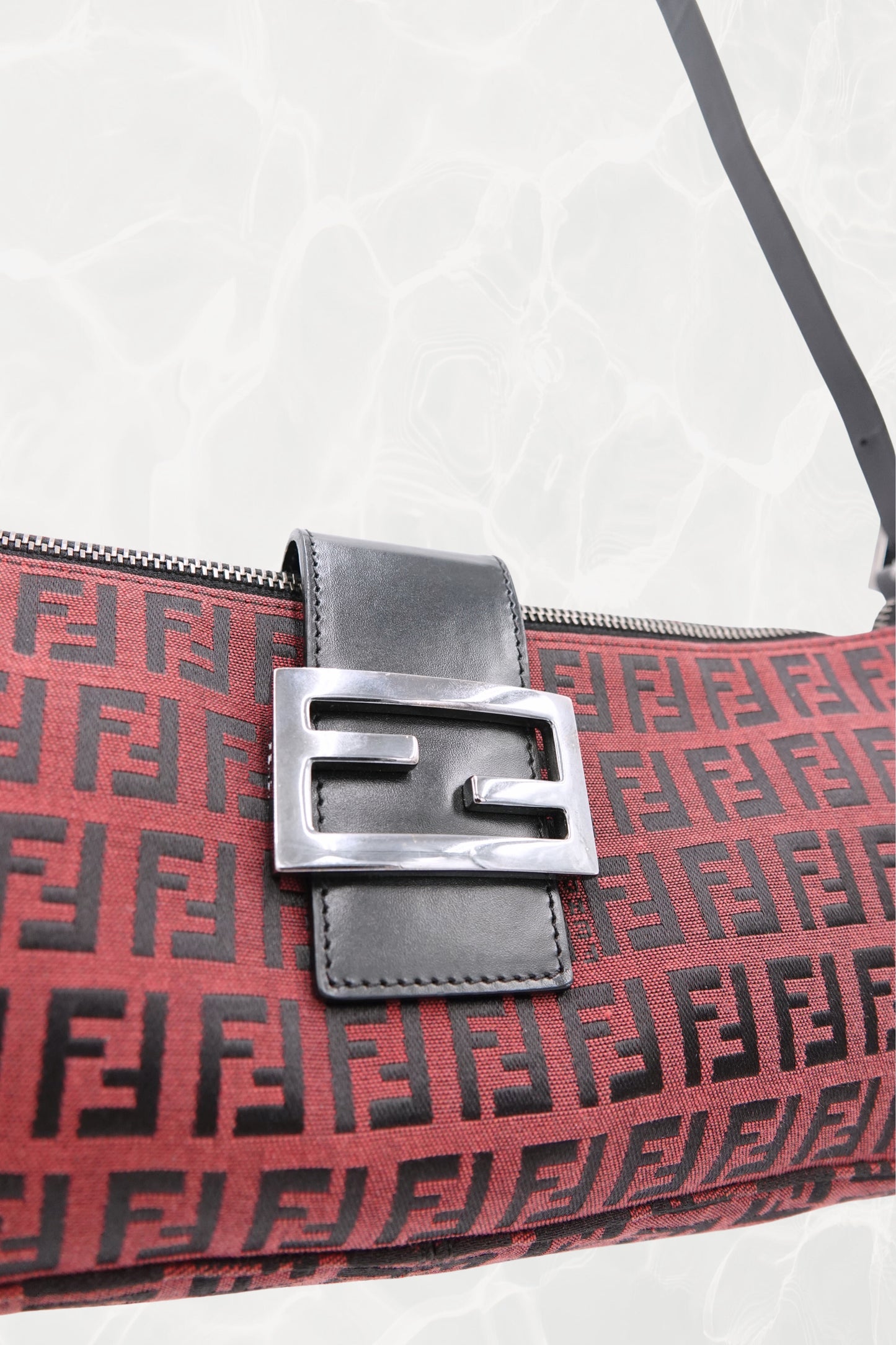 Fendi Zucchino FF monogram baguette, silver-tone FF buckle close-up — Disco Palma