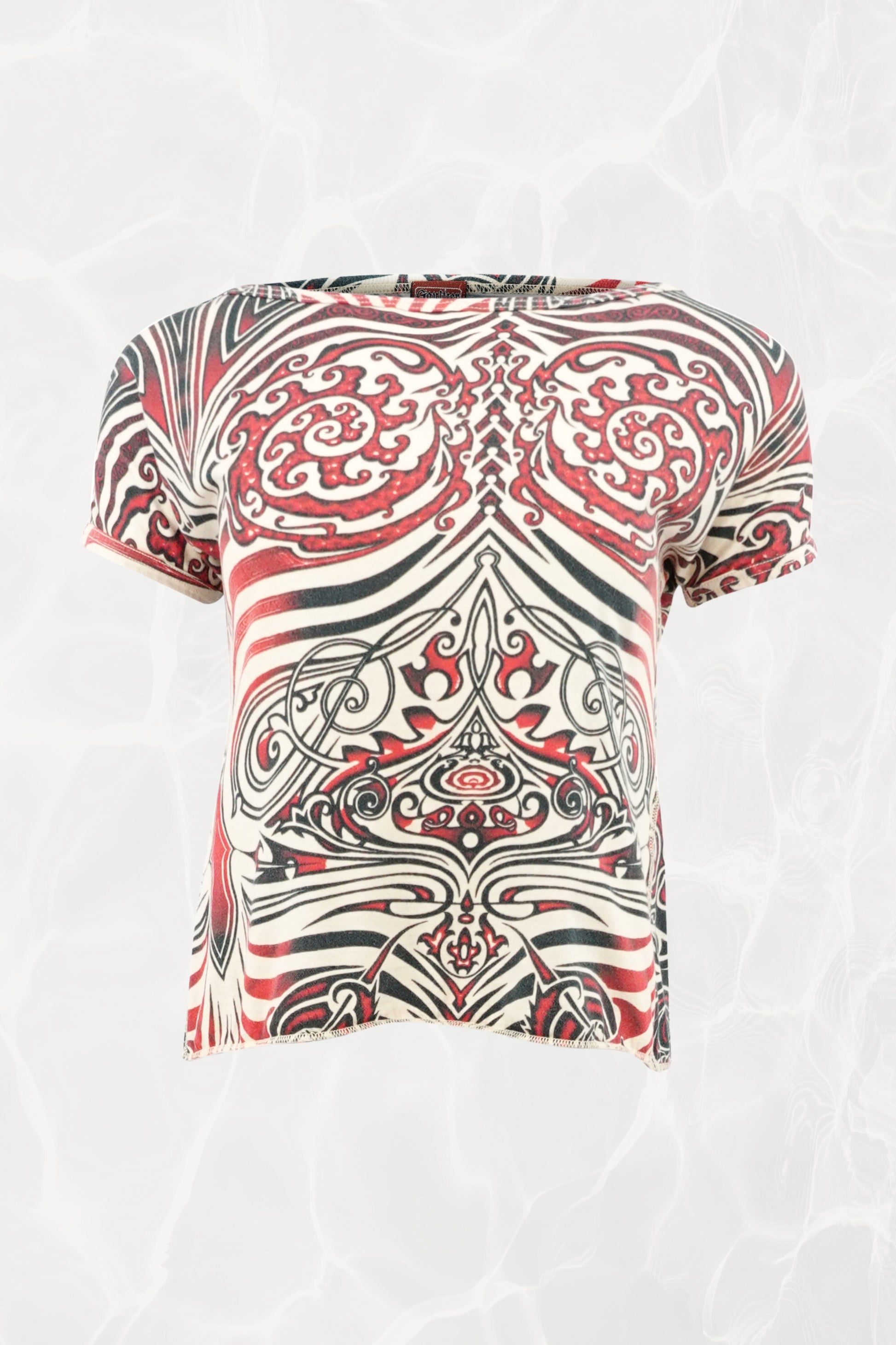 Jean Paul Gaultier JPG Jeans SS96 Cyberbaba crop top front view: short-sleeve jersey knit with tribal tattoo print in red, black and white, open-back design
