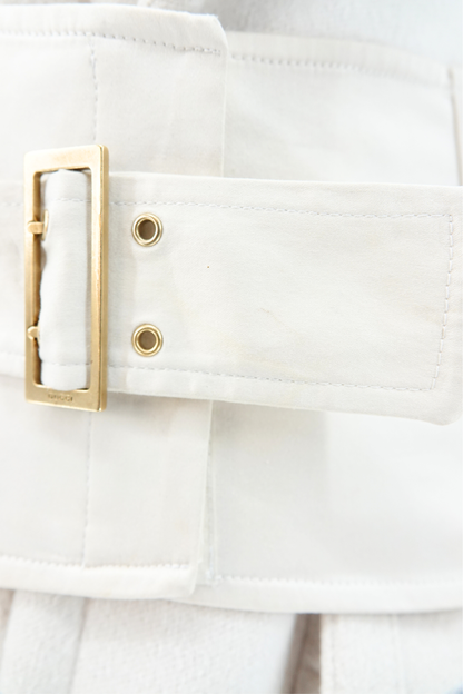 Tom Ford for Gucci AW03 white wool angora coat hardware detail: extreme close-up of gold-tone rectangular buckle on detachable corset belt with brass stud eyelets, Fall Winter 2003