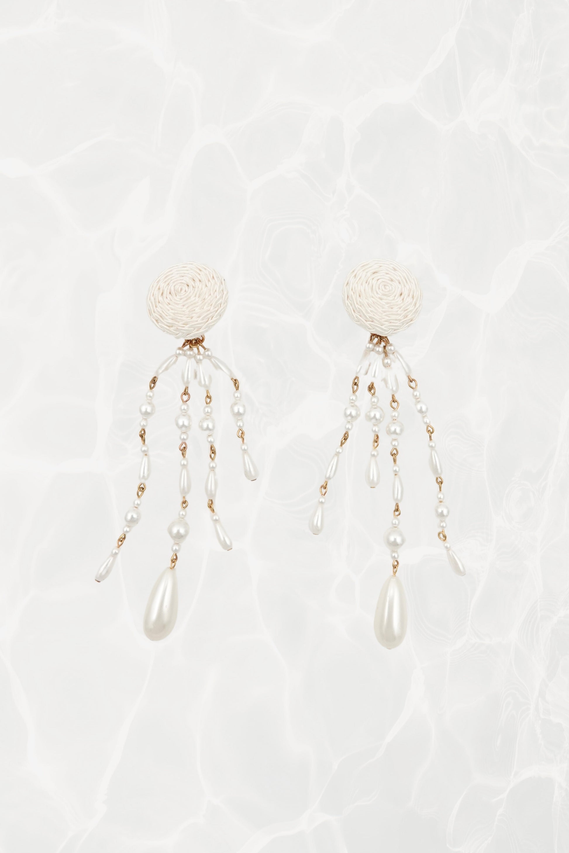 Vintage satin cord dome and faux pearl shoulder duster clip earrings, pair on textured background — Disco Palma