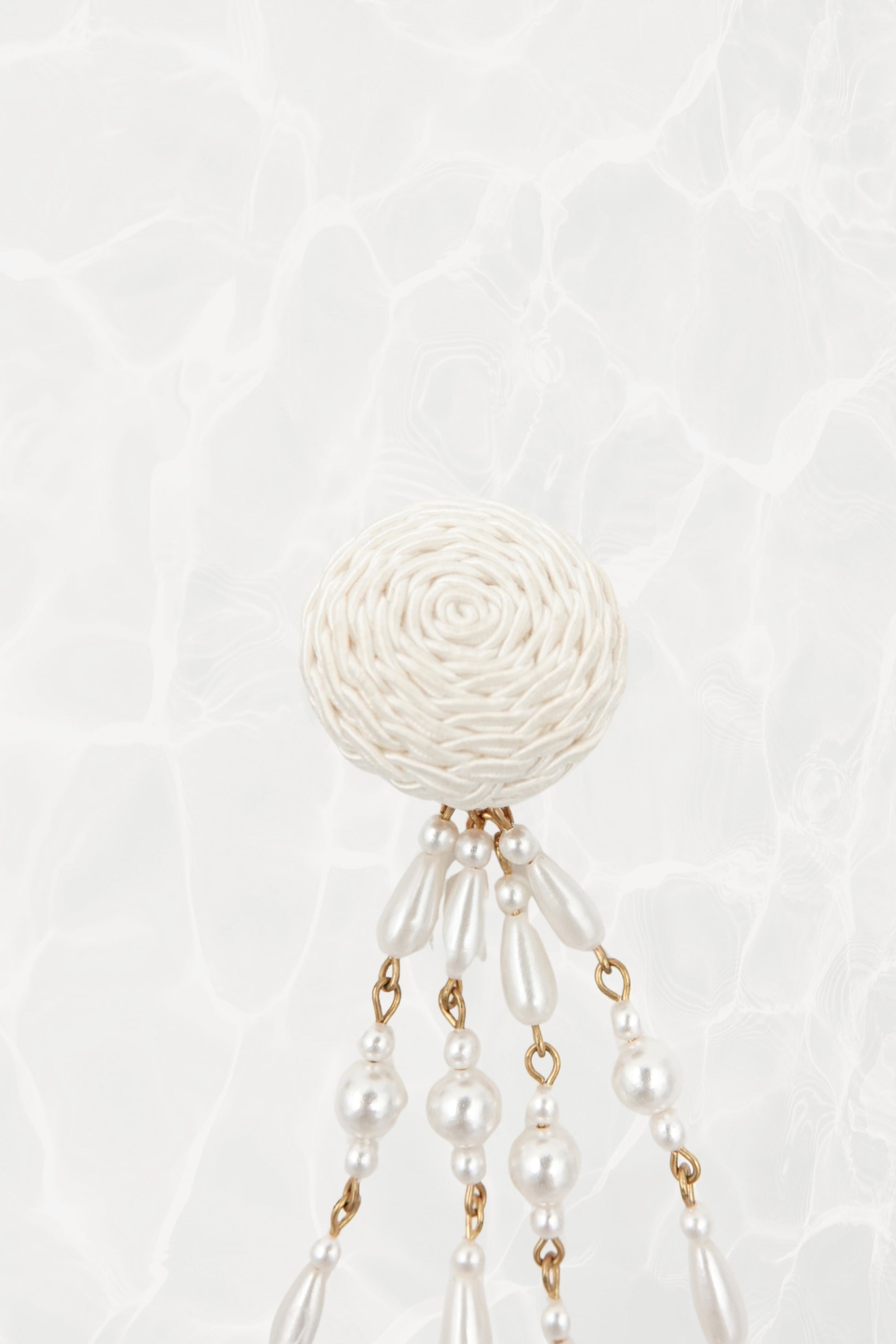 Vintage satin cord dome and faux pearl shoulder duster clip earrings, close-up detail on textured background — Disco Palma