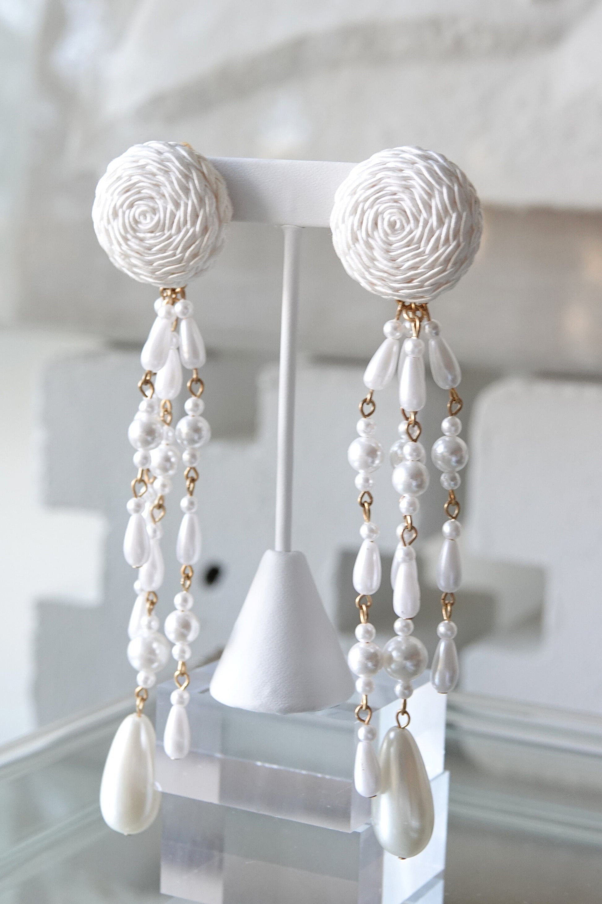 Vintage shoulder duster earrings with multi-strand faux pearl drops, styled — Disco Palma